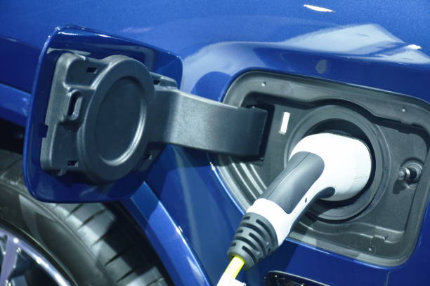 istock plug in electric vehicle charging to electrical car 1390466789