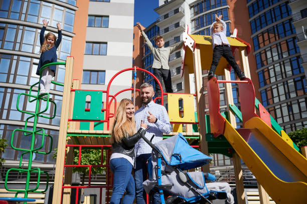 istock Big family spending time together on playground. 1390468283