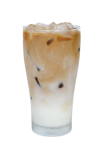 Iced coffee latte in a glass isolated on white background, clipping path included