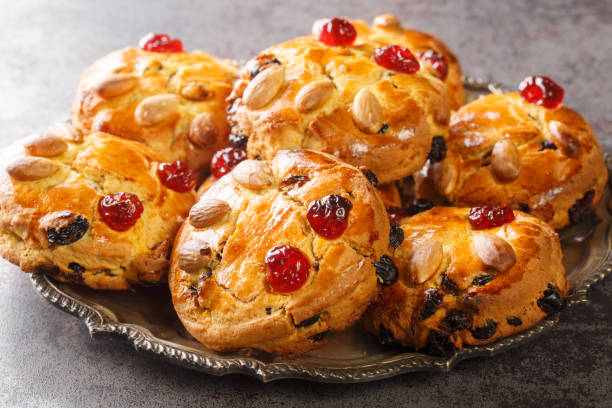 istock Christmas inspired Fat Rascal made with brandy butter, mixed fruit and citrus peel close-up in a plate. horizontal 1390472308