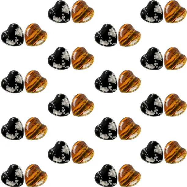 Natural stones heart shaped tiger eye stone and snowflake obsidian seamless pattern for Valentine's day. Romance and love
