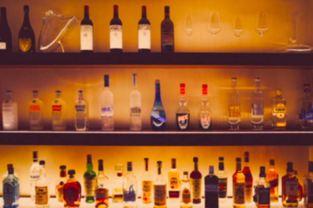 istock Bottle of liquor placed on a bar counter 1390479578