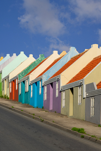 Road lined with colored Caribbean houses in Willemstad.