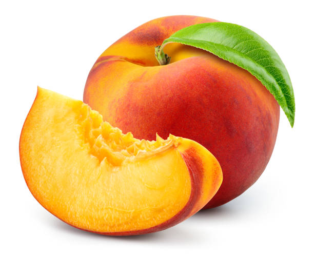 istock Peach isolated. Whole peach with a slice and leaf on white background. Peach fruit cut out. With clipping path. Full depth of field. 1390481281