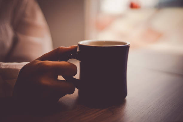 Women and hand drinking hot coffee. Shooting Location: Yokohama-city kanagawa prefecture