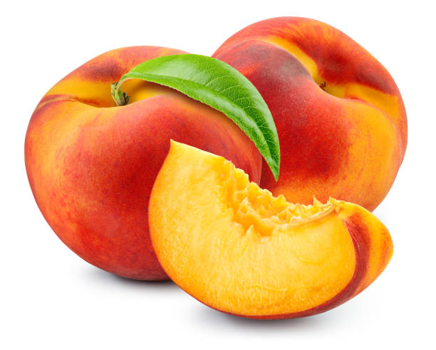 istock Peach isolated. Two peaches with a slice on white background. Peach fruit with leaf cut out. With clipping path. Full depth of field. 1390481853