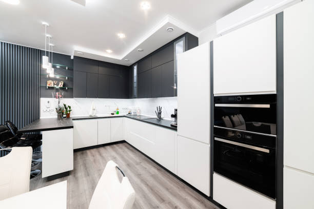 istock Functional kitchen in black and white with built-in appliances 1390482185