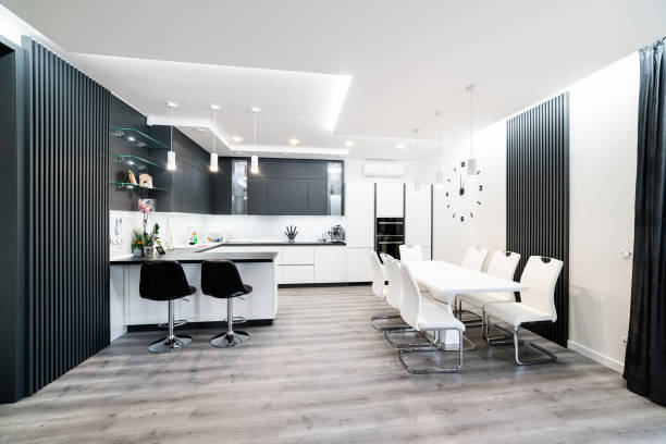 istock Large, stylish kitchen with black and white furniture 1390482303