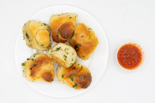 istock Garlic Knots and a Cup of Marinara Sauce 1390483559