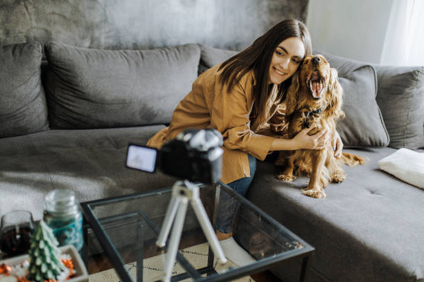 istock Woman and her dog Cocker Spaniel taking a selfie by camera 1390485811
