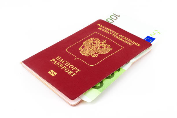 istock passport and money on a white background 1390489488