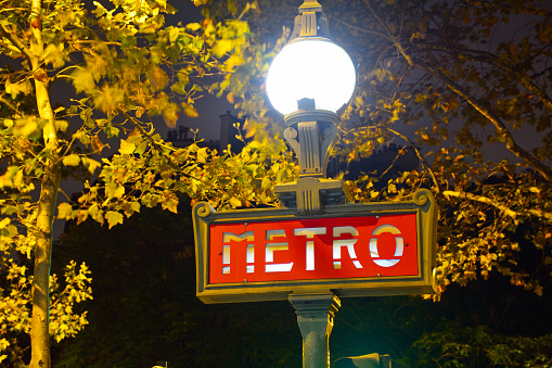 Paris Metropolitan sign in Dervaux model introduced in the 1930s with an orb-like lamp