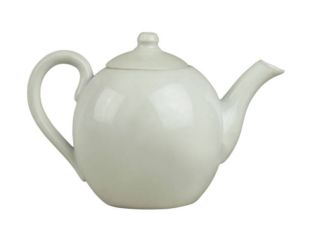 istock Retro white ceramic teapot isolated on white 1390494145