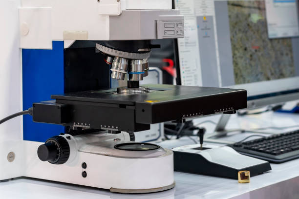 istock Close up sample or specimen during inspection by accuracy and precision microscope for quality control in industrial metallurgy electronic science etc of laboratory connect with monitor display 1390494381