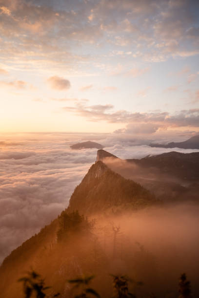 istock Hiking above the clouds in Austria with a beautiful view at various mountain peaks while sunrise. 1390494448