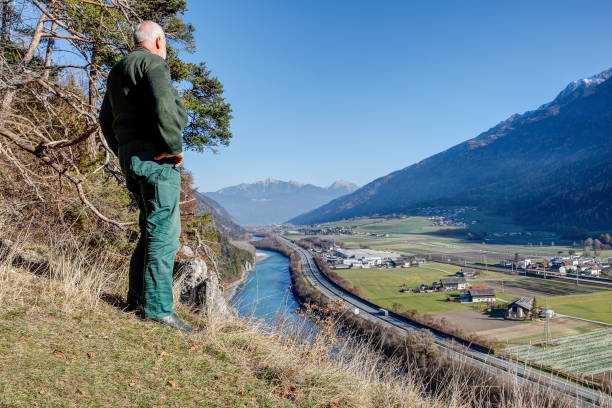 Hiker high above the Inn valley.