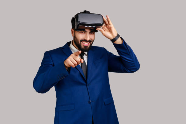istock Man with virtual reality glasses being ready for playing game simulator, choosing you as opponent. 1390498010