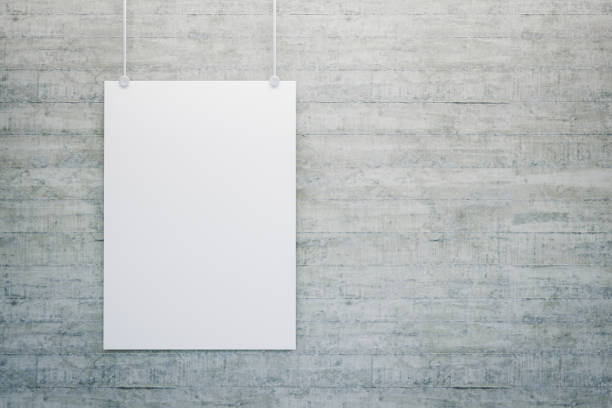 istock 3D render. Blank white poster mock-up hanging on the concrete wall with copy space 1390501488