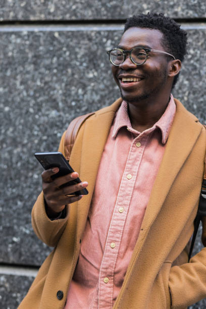 istock Portrait of young attractive black man using smart phone 1390502873