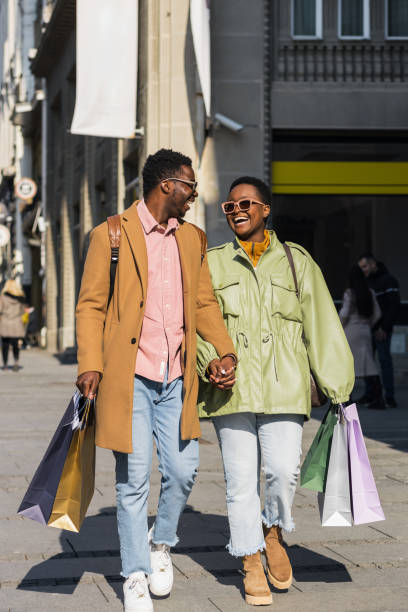 istock Happy black couple shopping together 1390503097