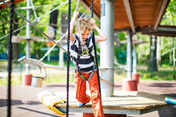Little boy in zip line park