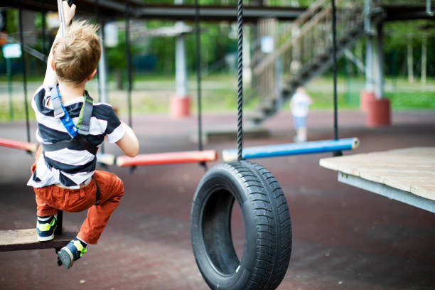 istock Little boy in zip line park 1390504199