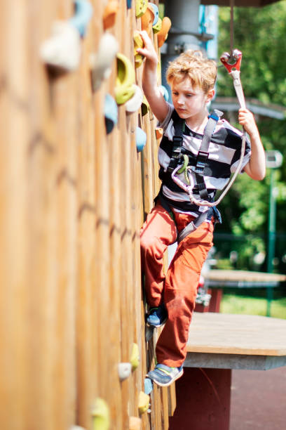 istock Little boy in zip line park 1390504200