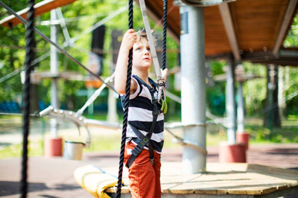 istock Little boy in zip line park 1390504201