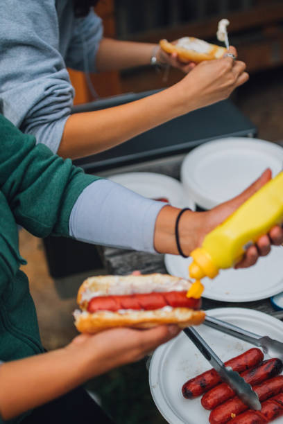 istock preparing bbq hotdog outdoors 1390511884