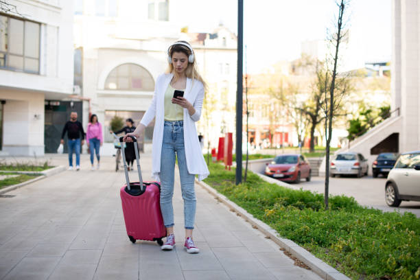 istock Tourist with her luggage 1390513287