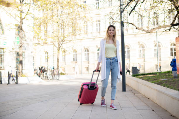 istock Tourist with her luggage 1390513818
