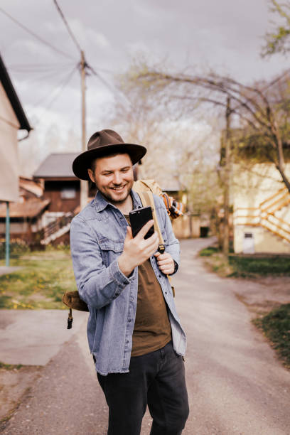 istock Traveler man exploring new city and using his smart phone 1390513855