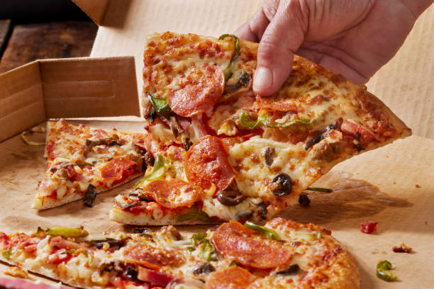 istock Deluxe New York Style Pizza 1390514445