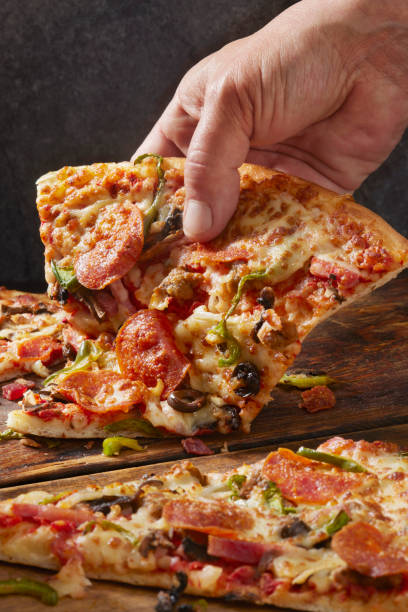 istock Deluxe New York Style Pizza 1390514531