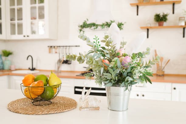 istock Easter bouquet and eggs on the table In white Scandinavian-style kitchen 1390515936