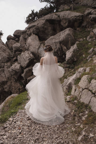 istock Long flowing wedding dress of the bride. 1390517021