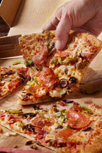 istock Deluxe New York Style Pizza 1390517105