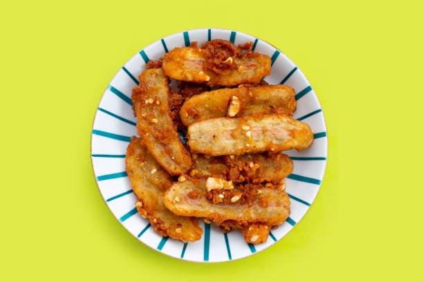 istock Deep-fried sliced banana on green background 1390521933