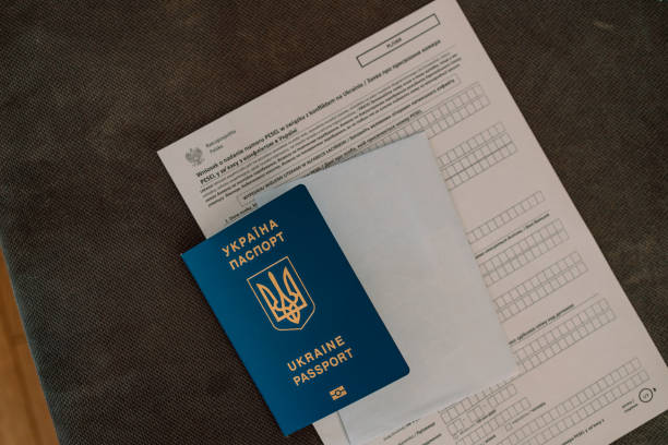 istock PESEL document, Ukrainian passport and a pen on white table background 1390522704