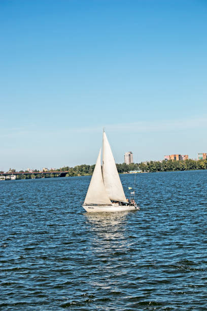 Dnepropetrovsk, Ukraine - 09.15.2021: Sailing yacht on the Dnieper river in windy weather.