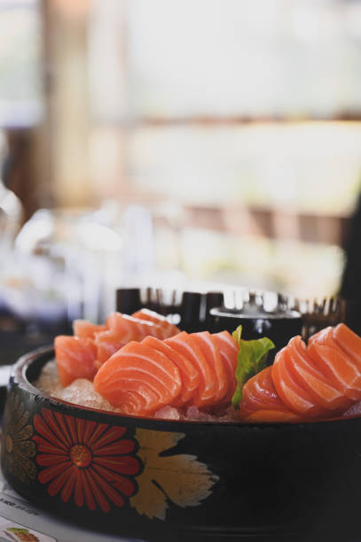 istock Salmon sashimi on ice Japanese food with selective focus with copy space 1390524780