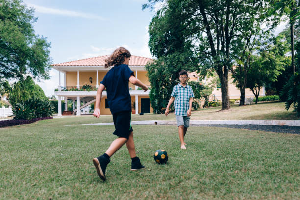 istock Young boys playing soccer 1390527048