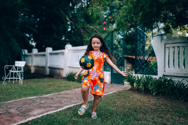 Young girl playing soccer