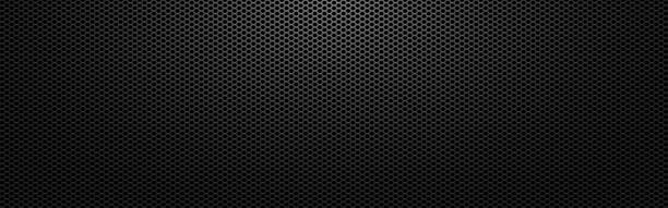 Black metal background. Perforated dark texture with light. Carbon sheet with holes. Abstract steel wallpaper wide. Modern composite material. Vector illustration Black metal background. Perforated dark texture with light. Carbon sheet with holes. Abstract steel wallpaper wide. Modern composite material. Vector illustration. wire mesh stock illustrations