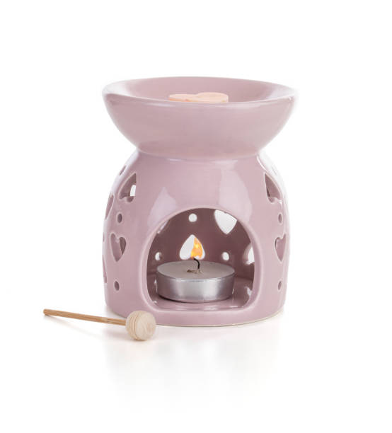 istock Pink perfume burner with a candle 1390529710