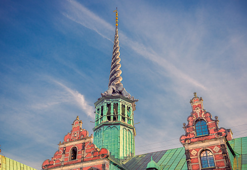 Tower with spire on the roof of the Old Stock Exchange Børsen Topped with four entwined dragon tails. Copenhagen, Denmark