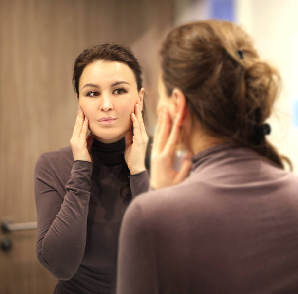 istock Magic anti-aging cream.Applying the cream. 1390531819