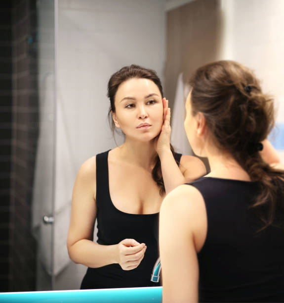istock Magic anti-aging cream.Applying the cream. 1390531821