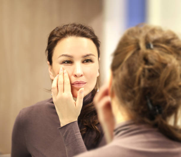 istock Magic anti-aging cream.Applying the cream. 1390531826