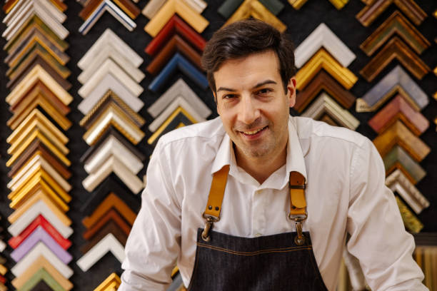 istock Caucasian male small business owner, working at his picture frame workshop 1390532140